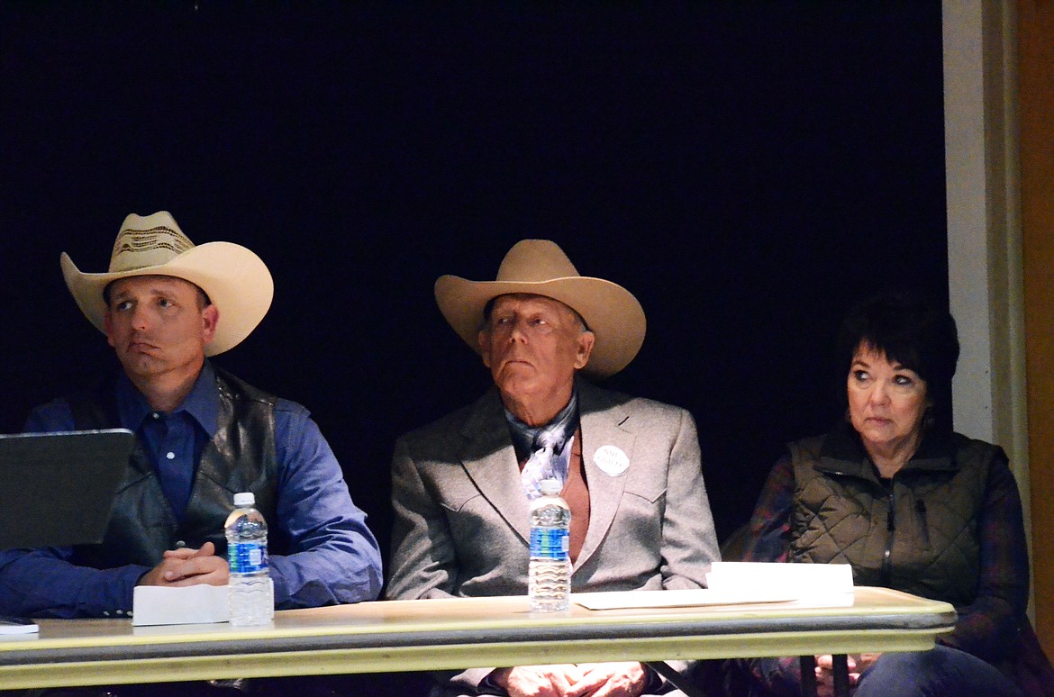 Ryan (L), Cliven (C) and Carol (R) Bundy listen intently to each speaker, their story and how they have been affected by fighting for Freedom and Property  (Erin Jusseaume/ Clark Fork Valley Press)