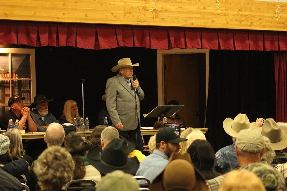 Cliven Bundy addresses the audience and other speakers at the Old Paradise School on Jan. 20 (Patrick Reilly/Daily Inter Lake)