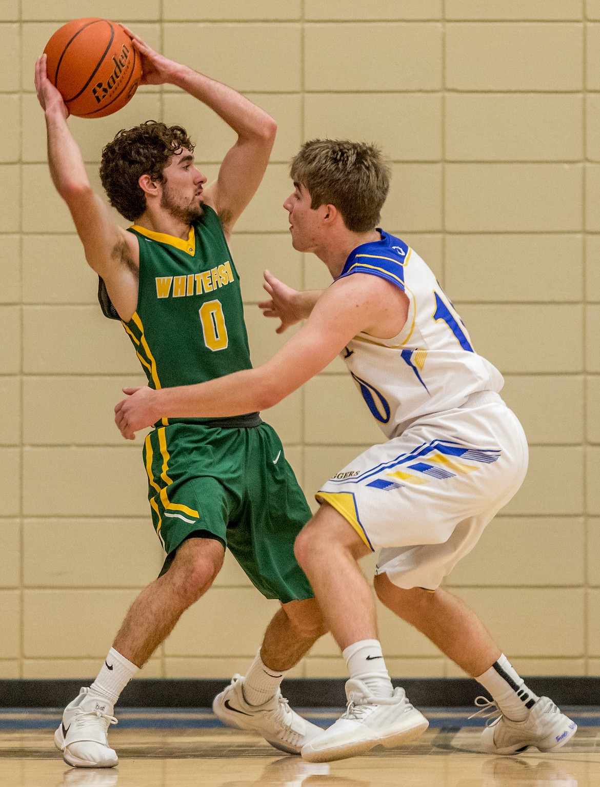 Libby&#146;s JJ Davis guards Whitefish&#146;s Alex Keuylian Friday in Libby. (John Blodgett/The Western News)