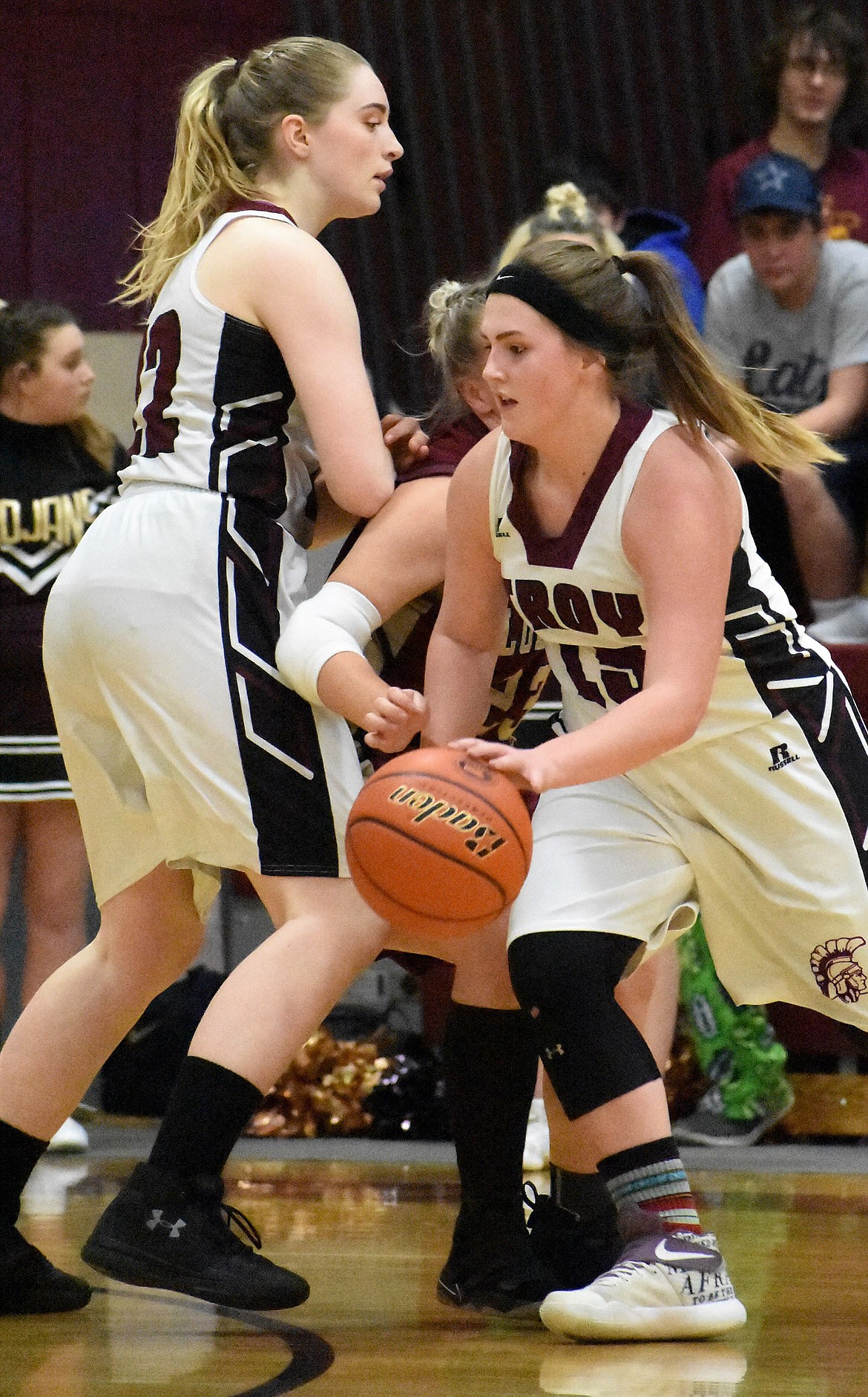 Troy&#146;s Kaitlyn Downey gets the ball as Grace Dolan blocks Forence defender Jewel Zeiler Saturday.