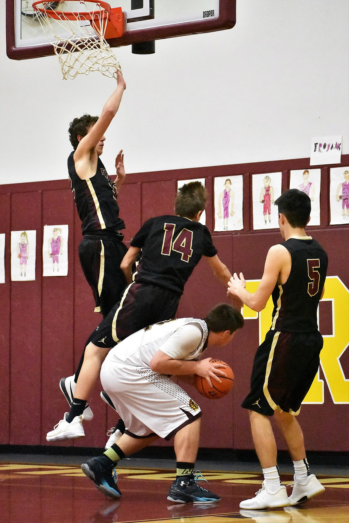 Troy&#146;s Alex Fruend grabs control of the ball against Florence Saturday in Troy. (Photo by Svetlana Harper)