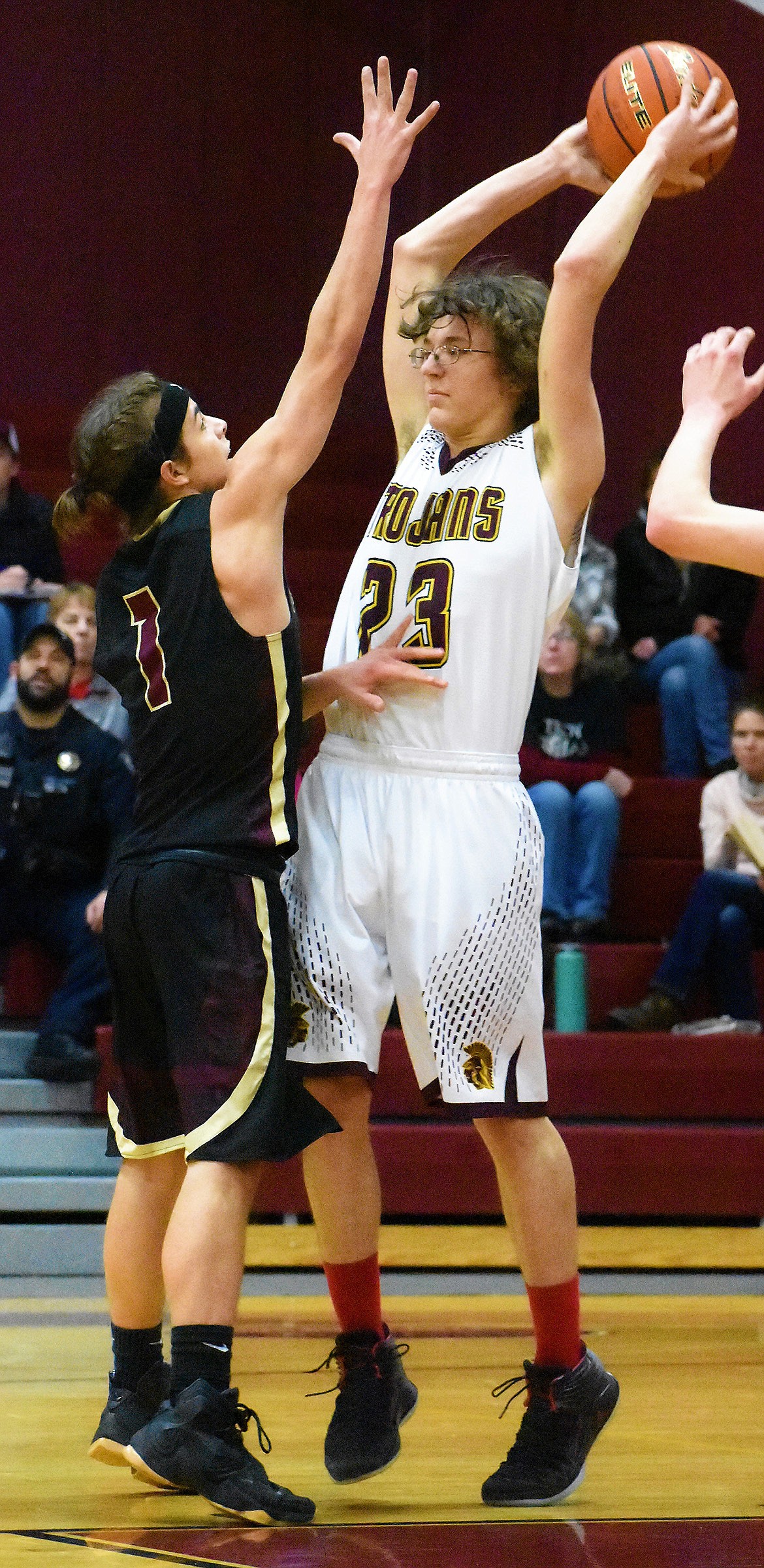 Troy&#146;s A.J. Faur prepares to pass beyond Florence&#146;s Tyee Pedersen Saturday in Troy. (Photo by Svetlana Harper)