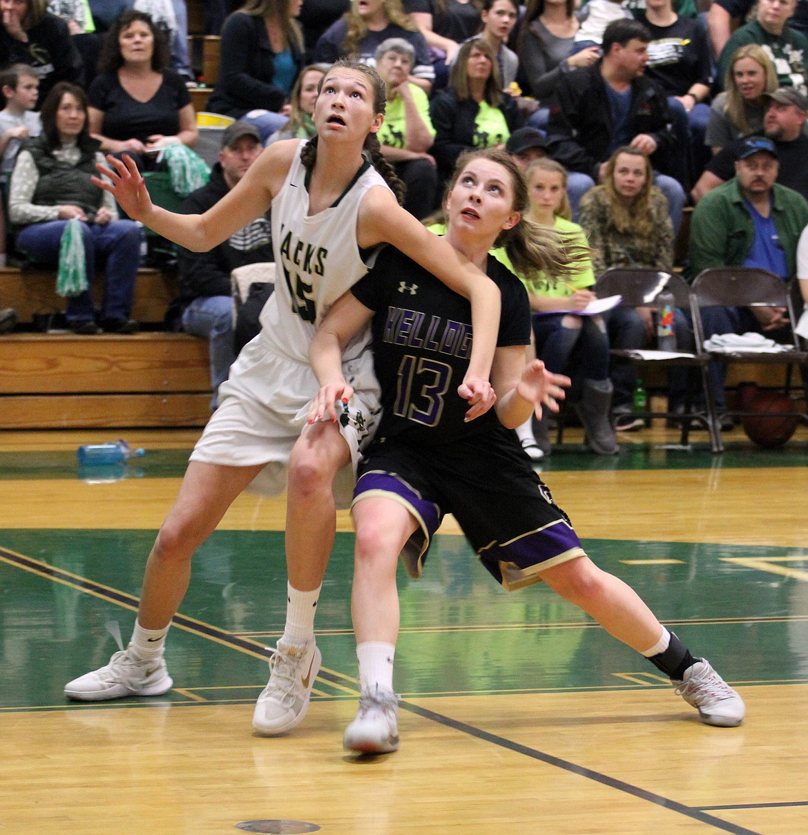 Kellogg&#146;s Kaitlin Senteney battles for position with her much taller opponent during the Wildcats&#146; 55-40 win at St. Maries on Saturday.