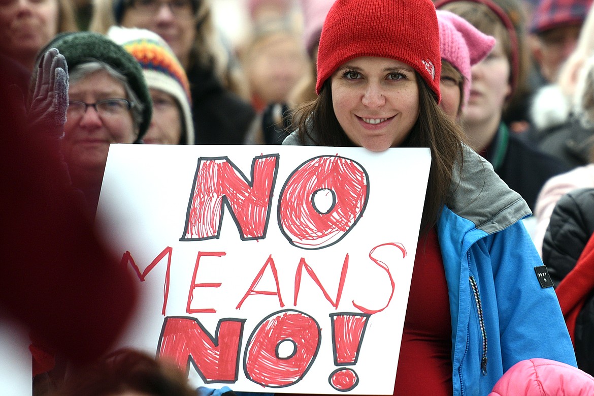 Attendees hold signs and cheer on a host of speakers during the Women's March in Depot Park in downtown Kalispell on Saturday, Jan. 20. (Casey Kreider/Daily Inter Lake)