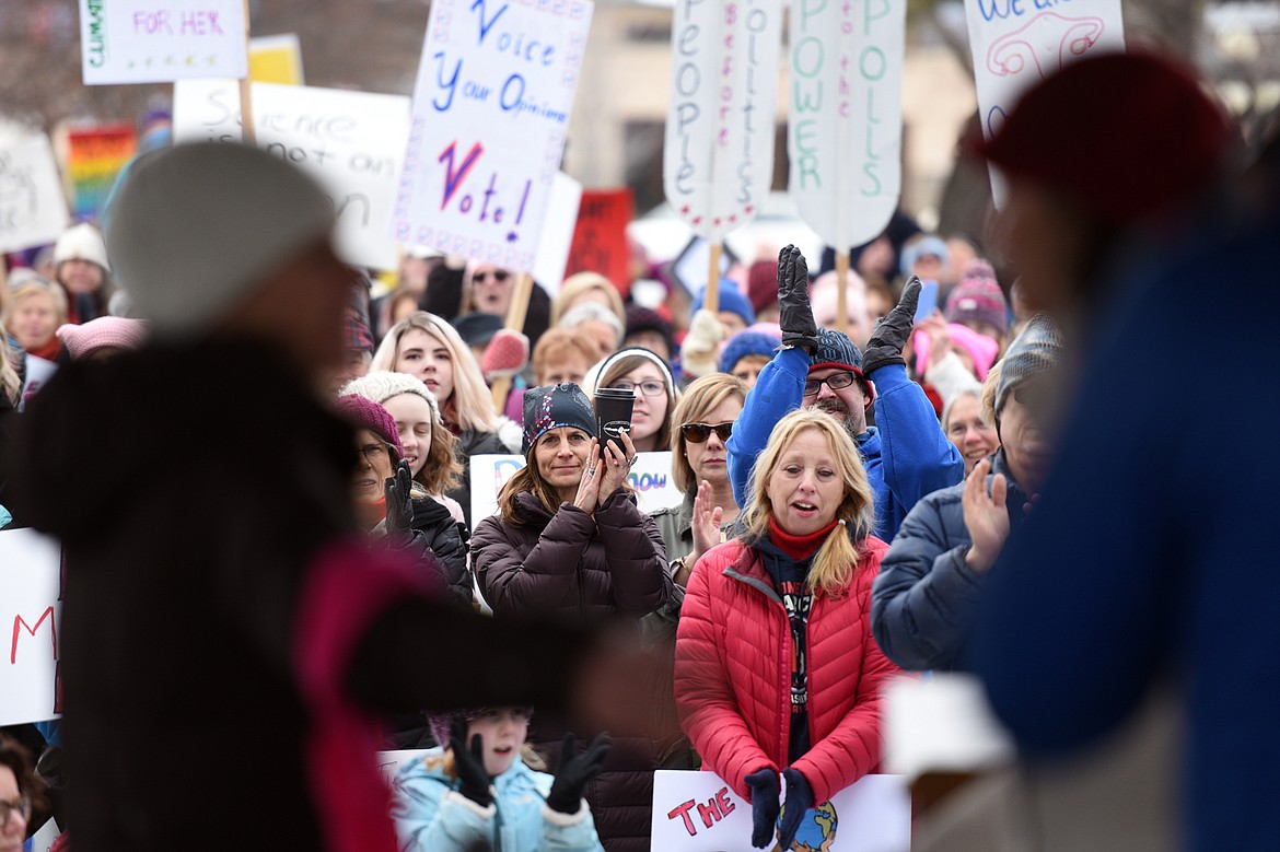 Attendees hold signs and cheer on speakers during the Women's March in Depot Park in downtown Kalispell on Saturday, Jan. 20. (Casey Kreider/Daily Inter Lake)