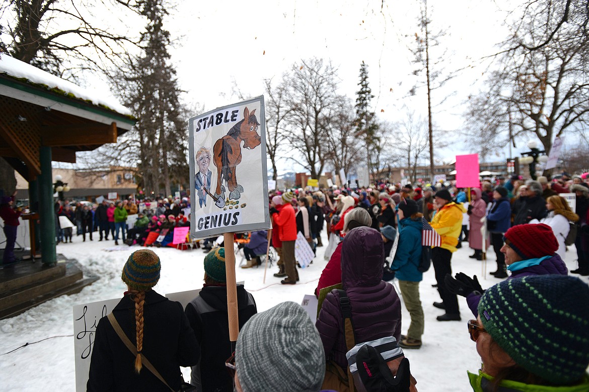 Attendees hold signs and cheer on speakers during the Women's March in Depot Park in downtown Kalispell on Saturday, Jan. 20. (Casey Kreider/Daily Inter Lake)