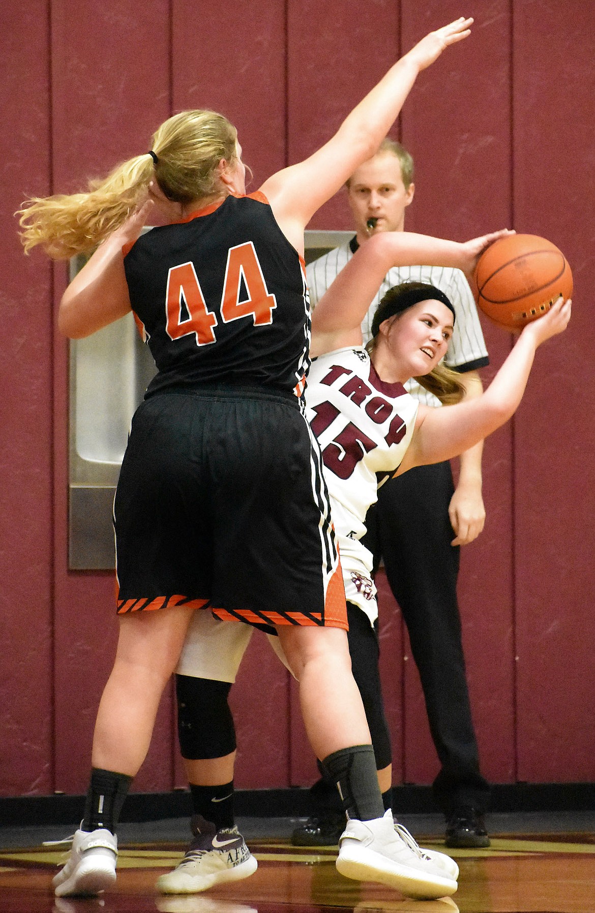 Troy&#146;s Kaitlyn Downey looks for an open teammate while guarded by Plains&#146; Jessica Thompson Friday in Troy. (Photo by Svetlana Harper)