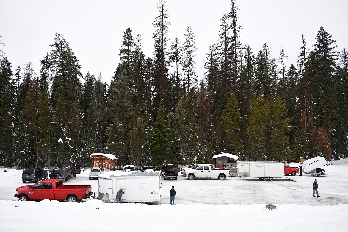 Riders unload their snowmobiles at the Swift Creek Trailhead in Whitefish for the Trans-Montana Charity Ride on Thursday, Jan. 18. (Casey Kreider/Daily Inter Lake)