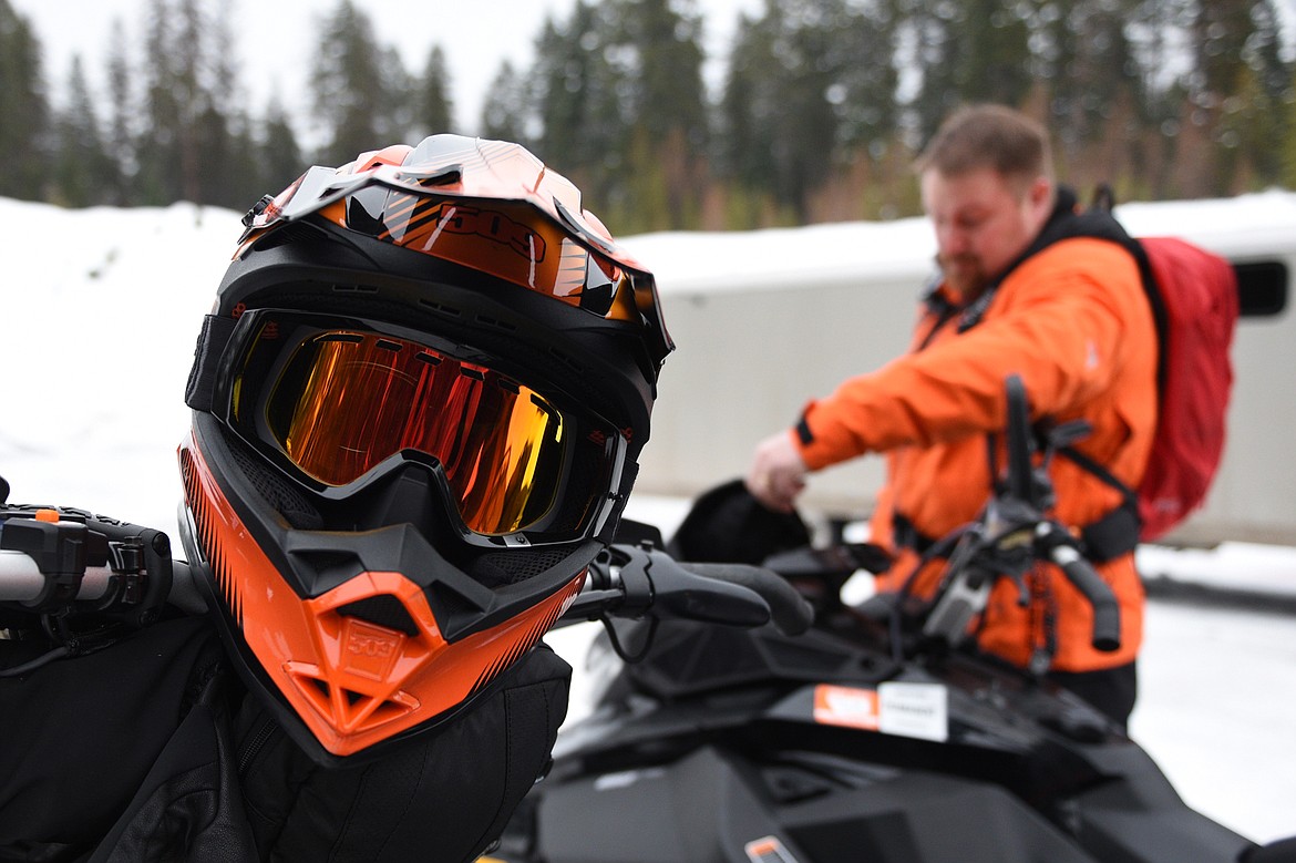 Bill McDaniel, safety coordinator with the Trans-Montana Charity Ride, readies his gear at the Swift Creek trailhead in Whitefish.