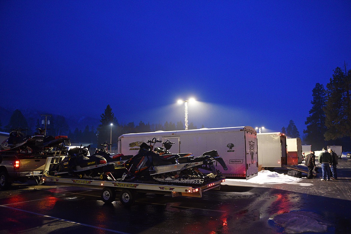 Riders make final checks in the parking lot of Cedar Creek Lodge in Columbia Falls before heading to the Swift Creek Trailhead in Whitefish for the start of the Trans-Montana Charity Ride on Thursday, Jan. 11. Snowmobilers take off down the Swift Creek Trail in Whitefish on the Trans-Montana Charity Ride on Thursday, Jan. 18. (Casey Kreider/Daily Inter Lake)