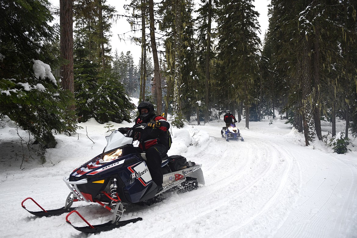 Snowmobilers take off down the Swift Creek Trail in Whitefish on the Trans-Montana Charity Ride on Thursday, Jan. 18. (Casey Kreider/Daily Inter Lake)