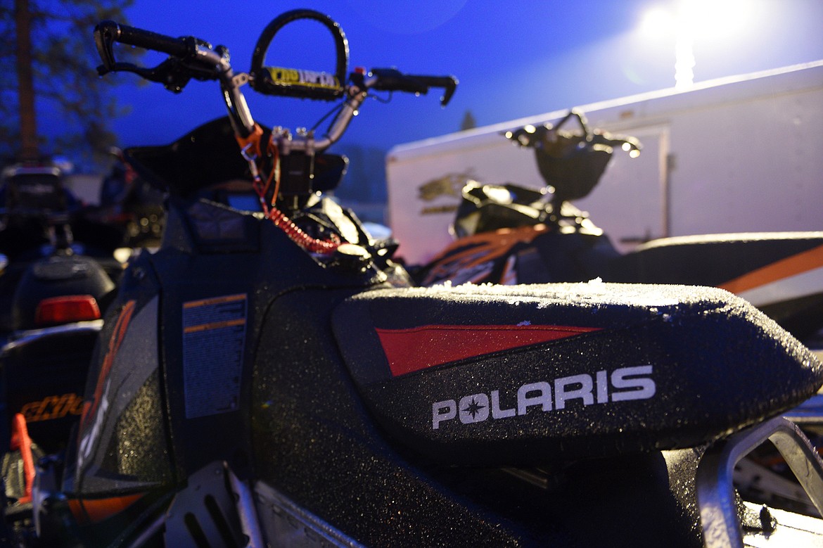 Freezing rain coats a snowmobile in the parking lot of Cedar Creek Lodge in Columbia Falls on Thursday, Jan. 18. (Casey Kreider/Daily Inter Lake)