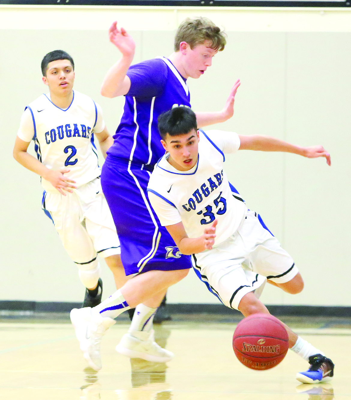 Connor Vanderweyst/Columbia Basin Herald
Warden point guard Dreyton Martinez (35) slides past a Columbia defender.