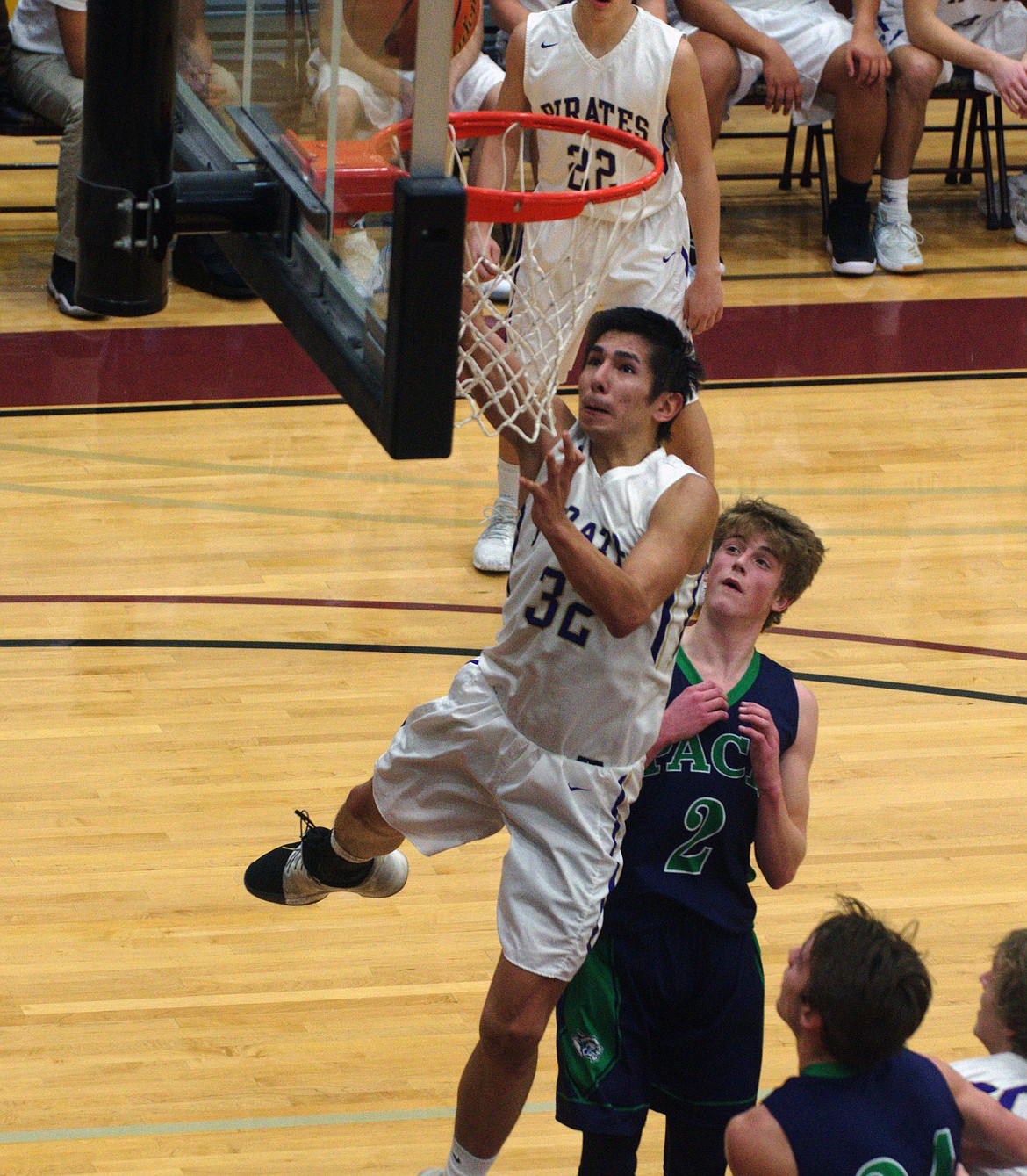 POLSON FORWARD Shade Main (32) drives to the basket in Thursday night's game against Glacier at Joe McDonald gym at Salish Kootenai College. (Jason Blasco/Lake County Leader)