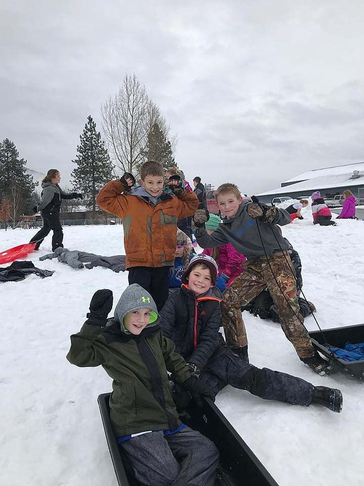 Third- and fourth-graders at Superior Elementary School enjoy themselves with a sledding party. It is part of the school&#146;s Montana Behavior Initiative to improve students behavior. (Photo courtesy of Superior Elementary School)