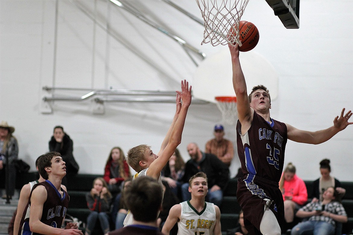 Clark Fork Mountain Cat Connor Voll goes for a layup during Thursday&#146;s game against St. Regis. Cats won 54-41. (Kathleen Woodford/Mineral Independent)