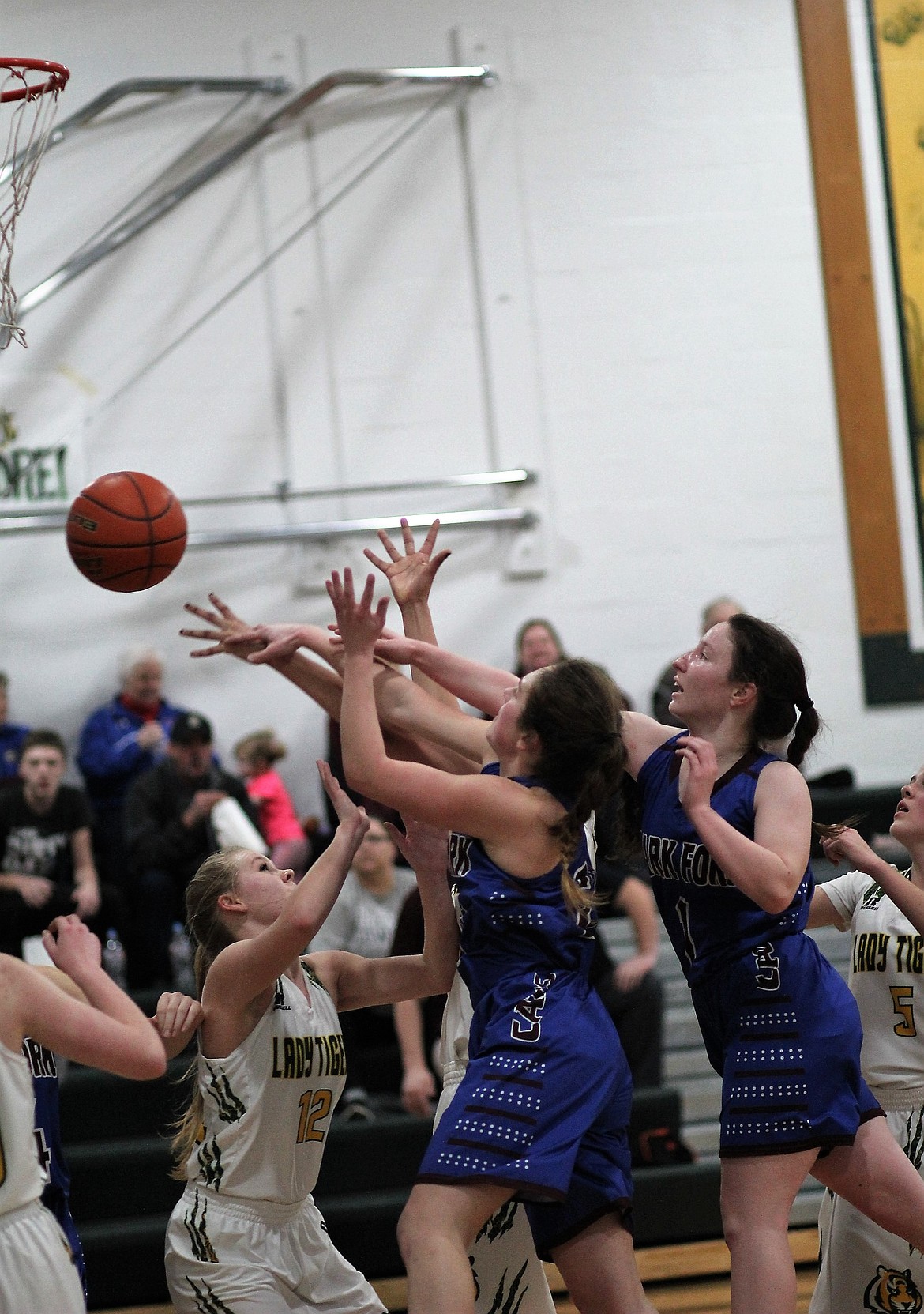 Clark Fork Mountain Cats girls grab for the ball during their game against St. Regis on Jan. 18. The Cats won and are currently undefeated in conference play. (Kathleen Woodford/Mineral Independent).