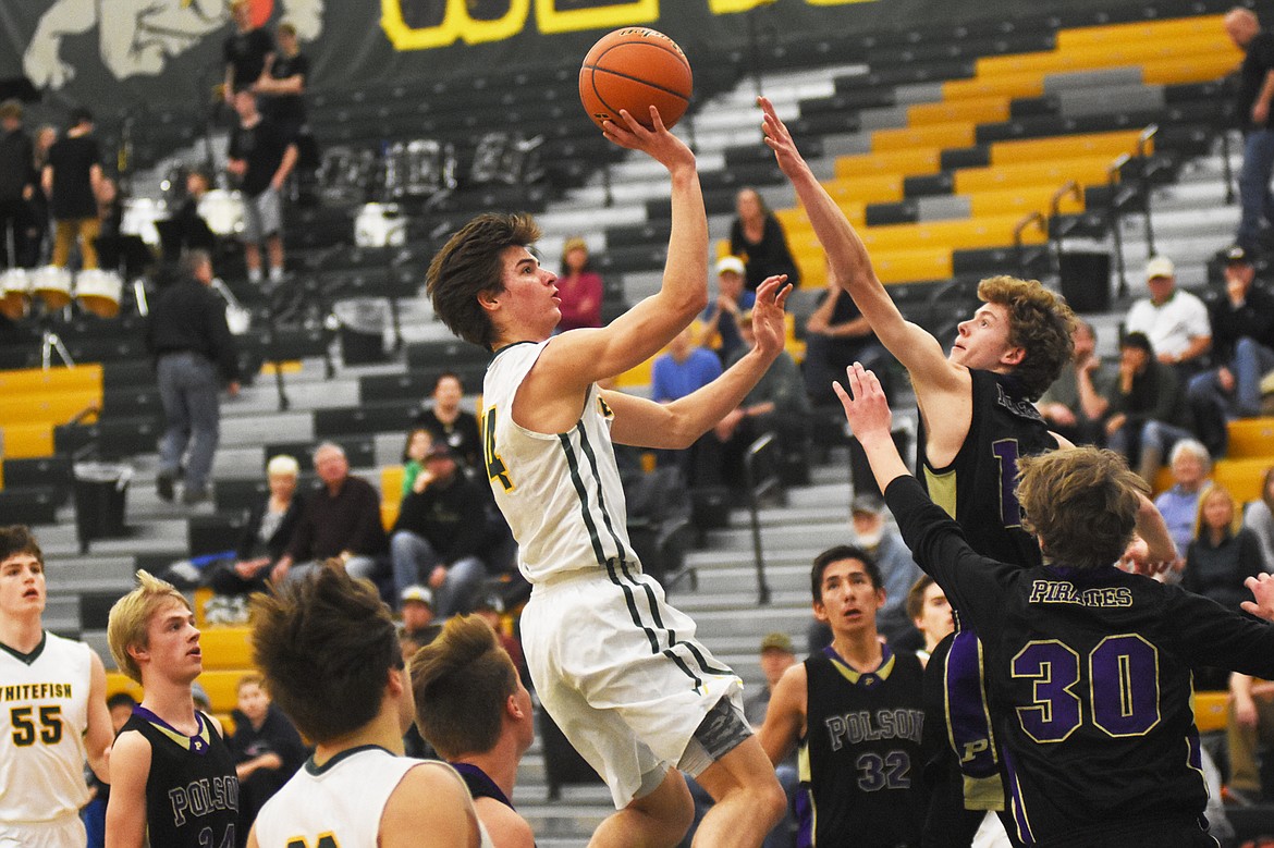 Lee Walburn rises for the floater during Saturday&#146;s home loss against Polson at Whitefish. (Daniel McKay/Whitefish Pilot)