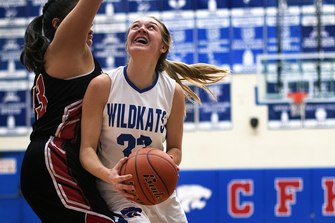 Ryley Kehr goes in for two in the Wildkats&#146; home win over Browning Thursday. Kehr scored 13 in the victory. (Jeremy Weber photo)