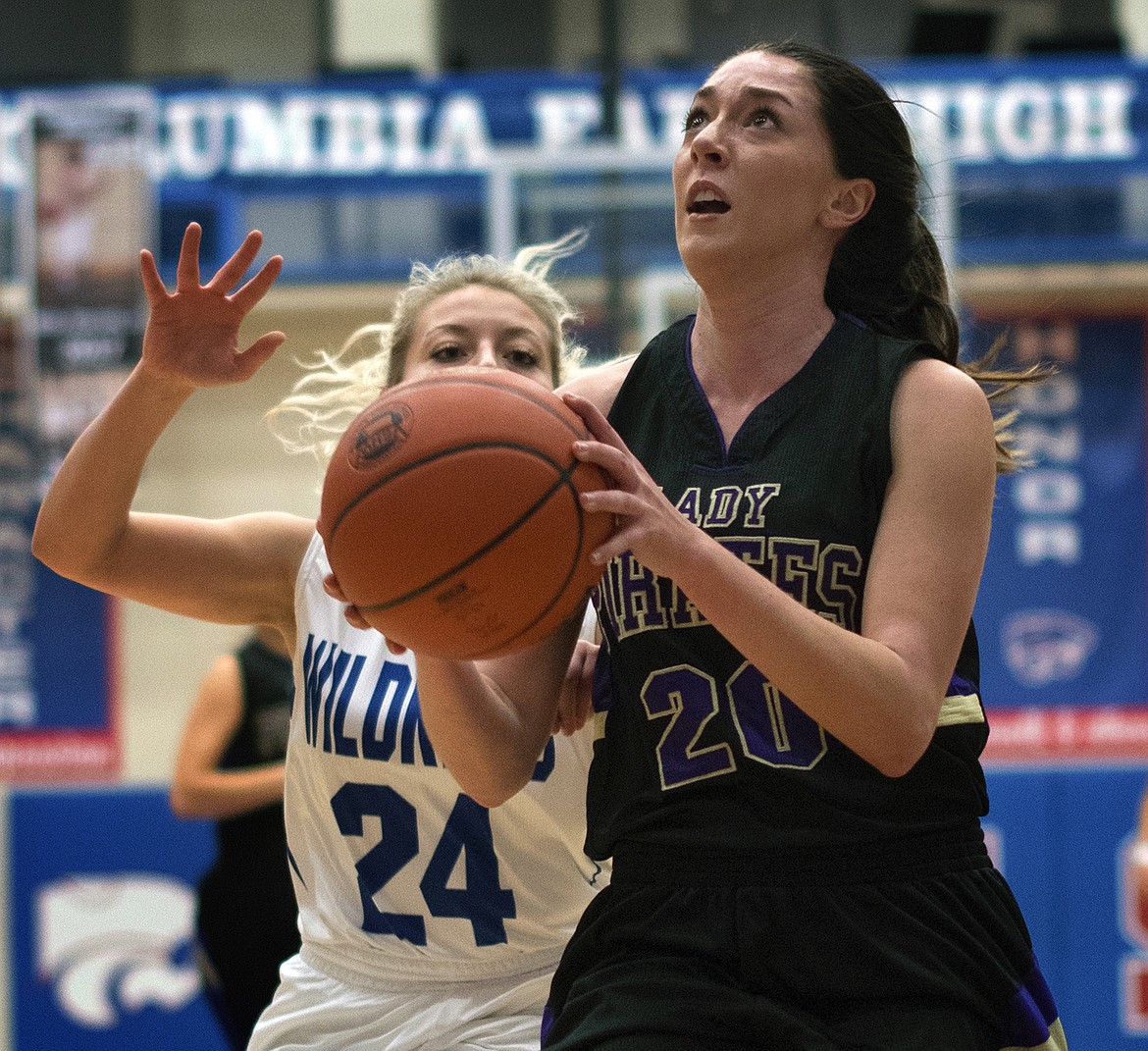 Kaelyn Smith drives to the basket against Columbia Falls Saturday. Smith finished with 20 points in the contest. (Jeremy Weber photo)