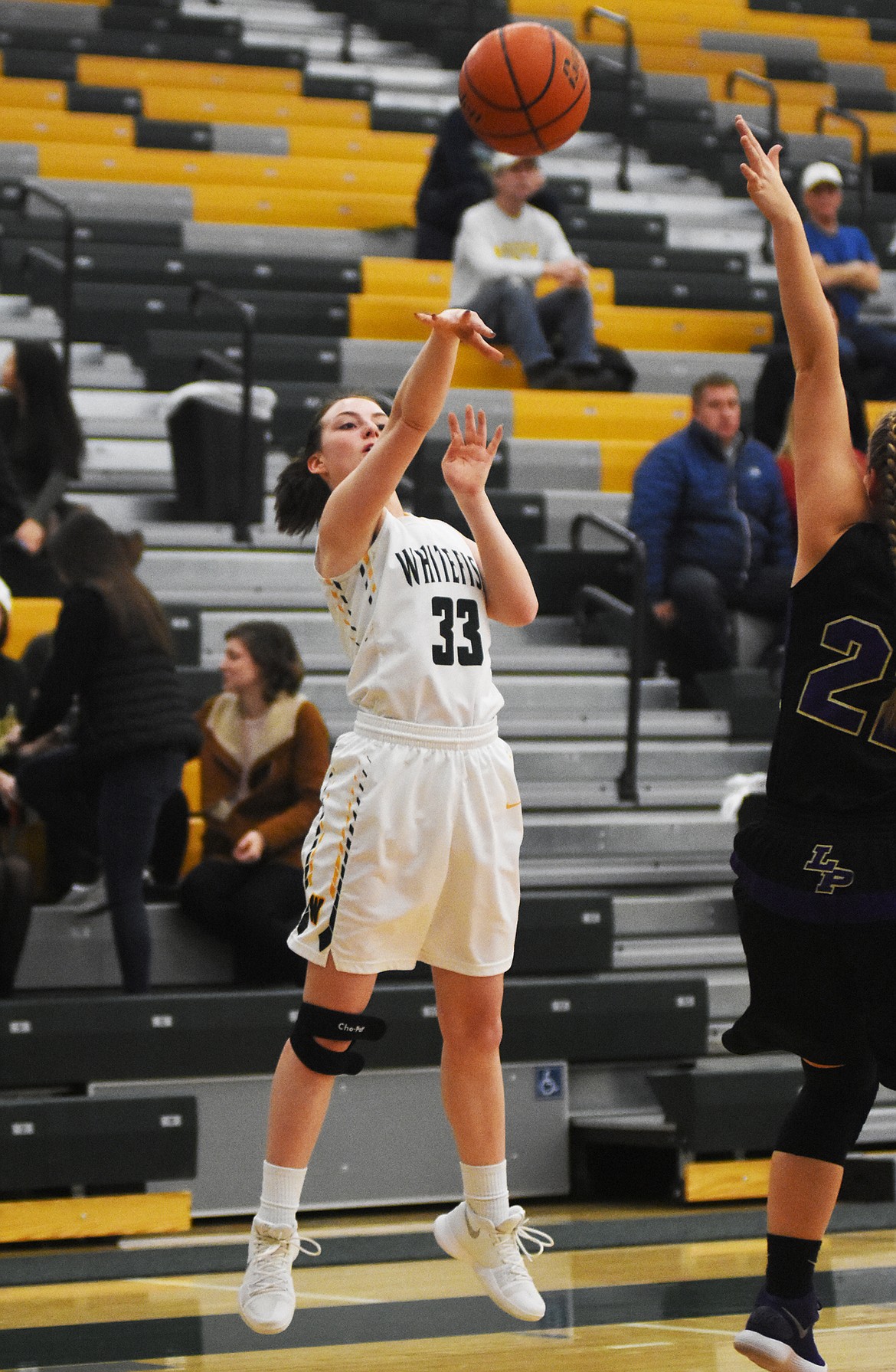 Payton Kastella launches a three against Polson Saturday night at Whitefish Highs School. (Daniel McKay/Whitefish Pilot)