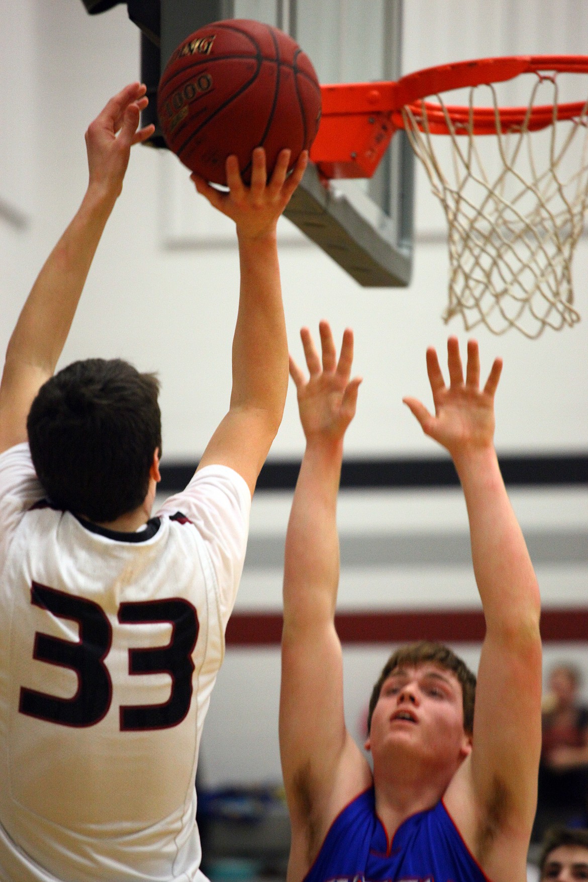 Rodney Harwood/Columbia Basin HeraldAHC senior Payton Nielsen (33) goes to the rim against Curlew Friday night.