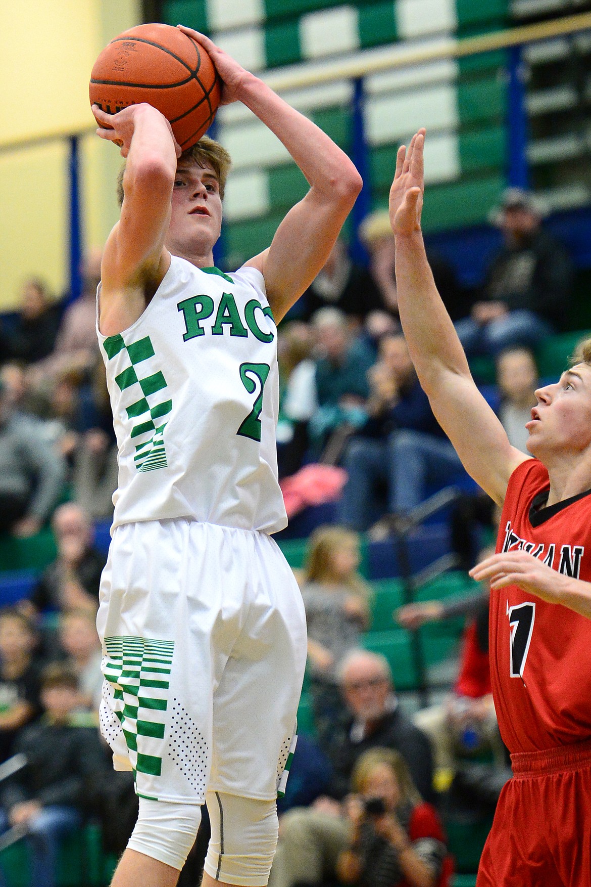 Glacier's Caden Harkins shoots over Bozeman defender Robbie Simpson. (Casey Kreider/Daily Inter Lake)