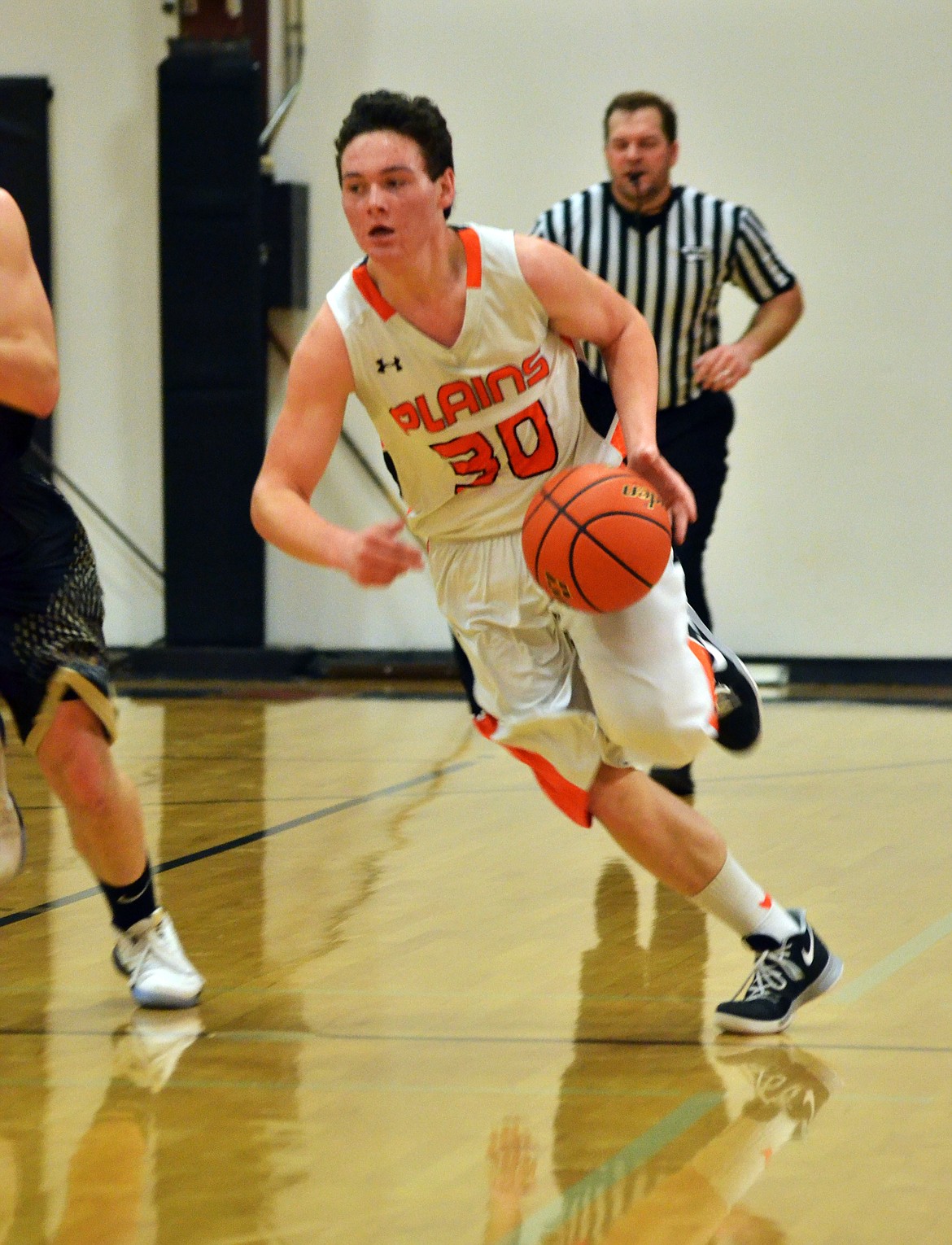 Matt McCracken (30) uses speed to get around the Black Hawks back to Horsemen territory (Erin Jusseaume/ Clark Fork Valley Press)