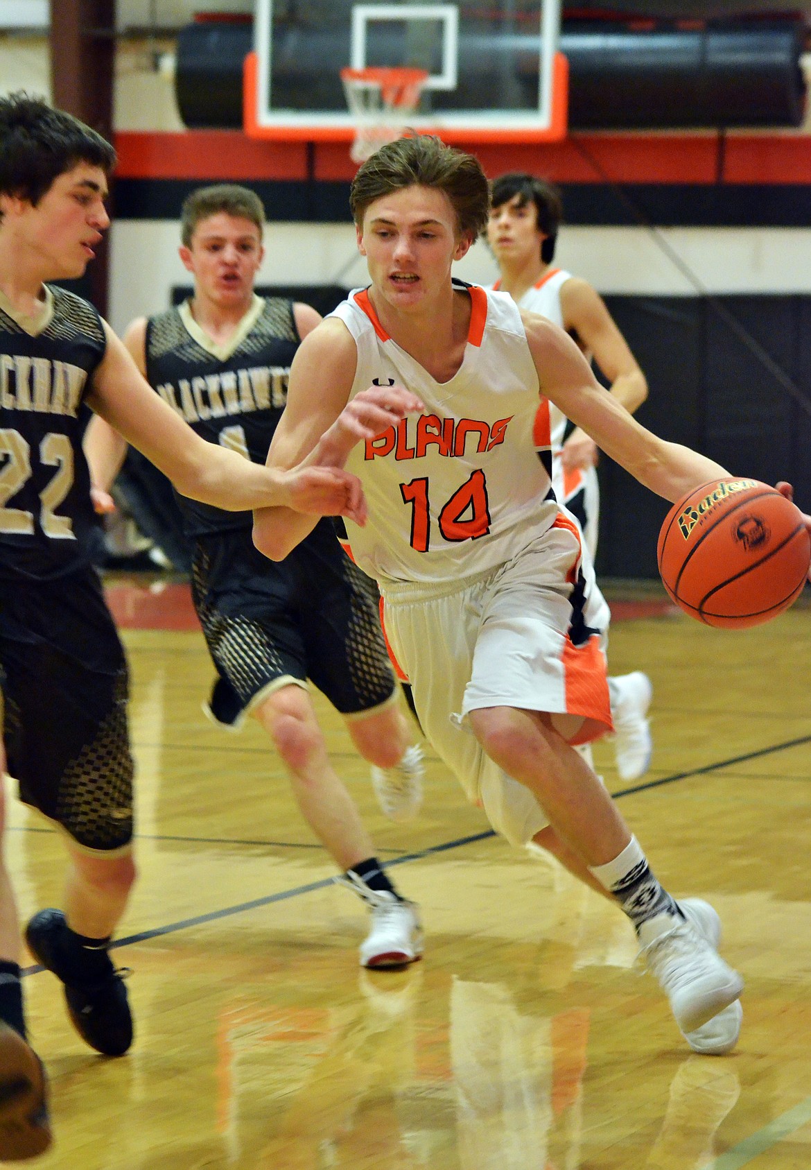 Kyle Weeks (14) pushes through a weak Black Hawk defense (Erin Jusseaume/ Clark Fork Valley Press)