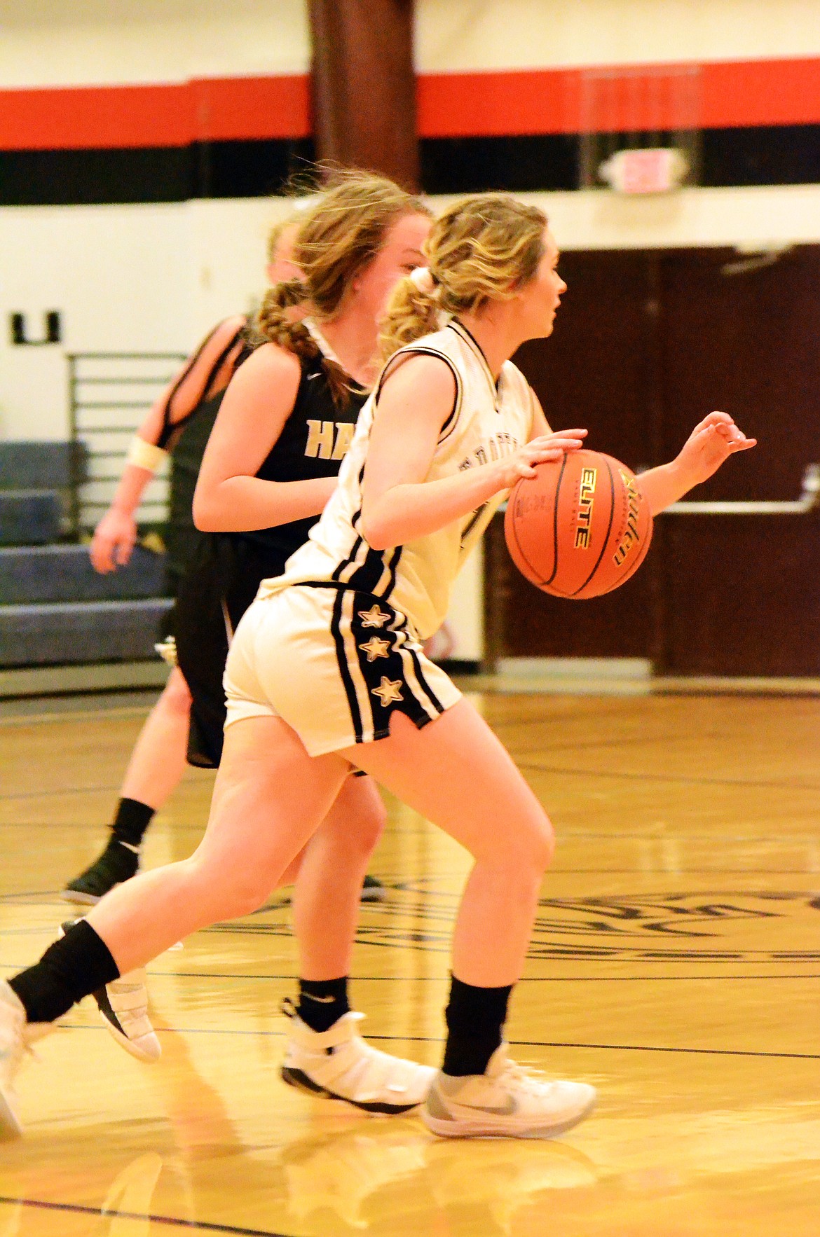 Linday Laws (12)pushes through a Blawk Hawk defense  (Erin Jusseaume/ Clark Fork Valley Press)