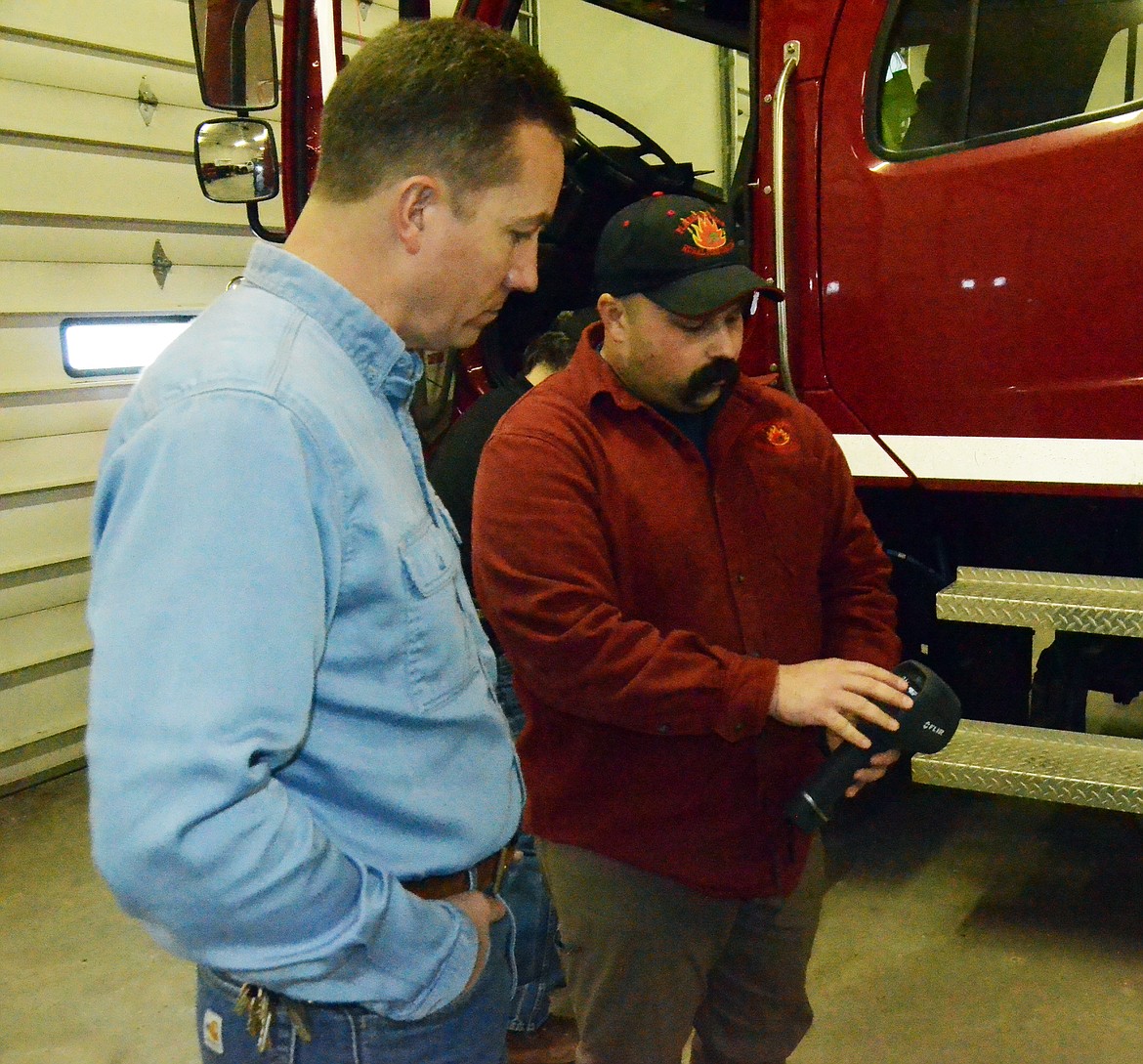 Chief Russell explains the mechanics of the heat seeker and what will be available for them to use once they purchase a more updated version (Erin Jusseaume/ Clark Fork Valley Press)