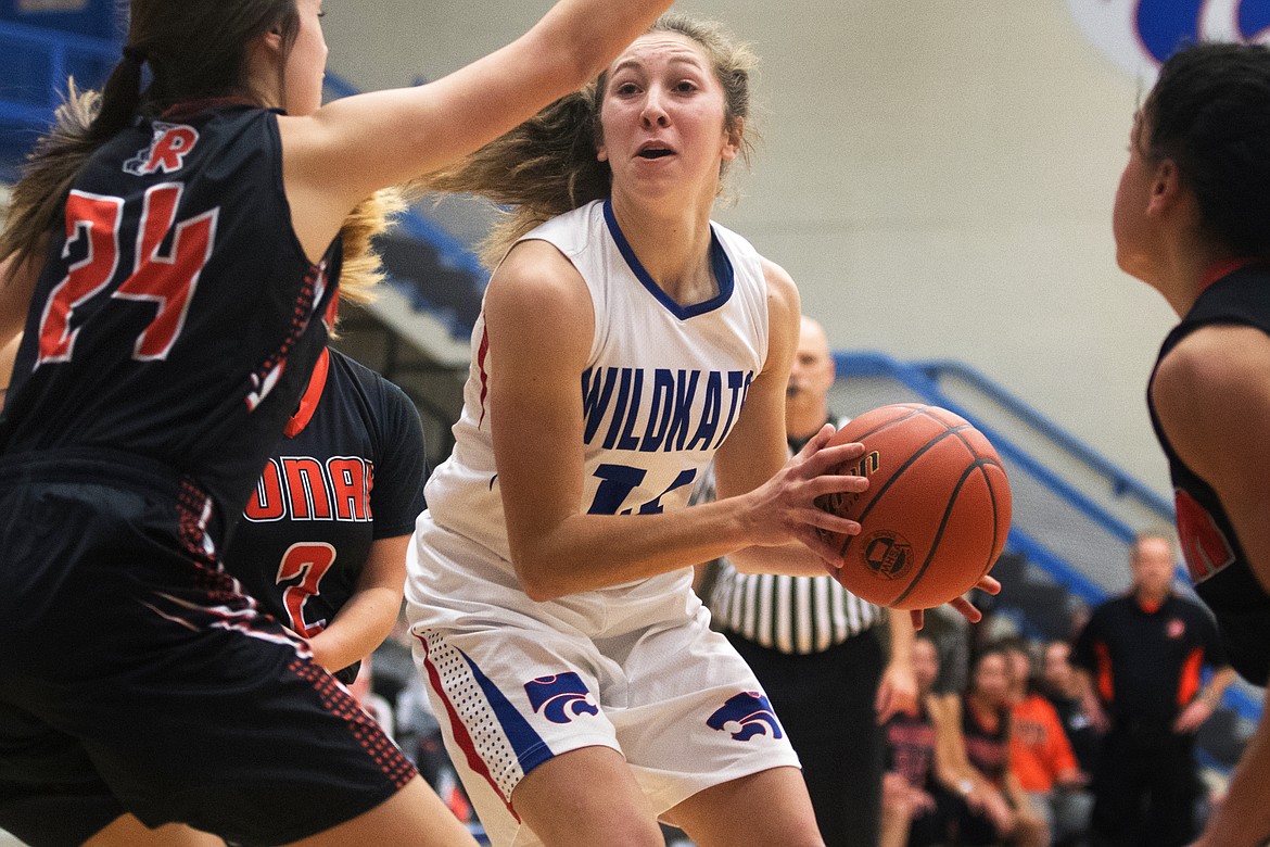 Josie Windauer takes the ball inside against Ronan Saturday. Windauer scored four in the Wildkat win. (Jeremy Weber photo)