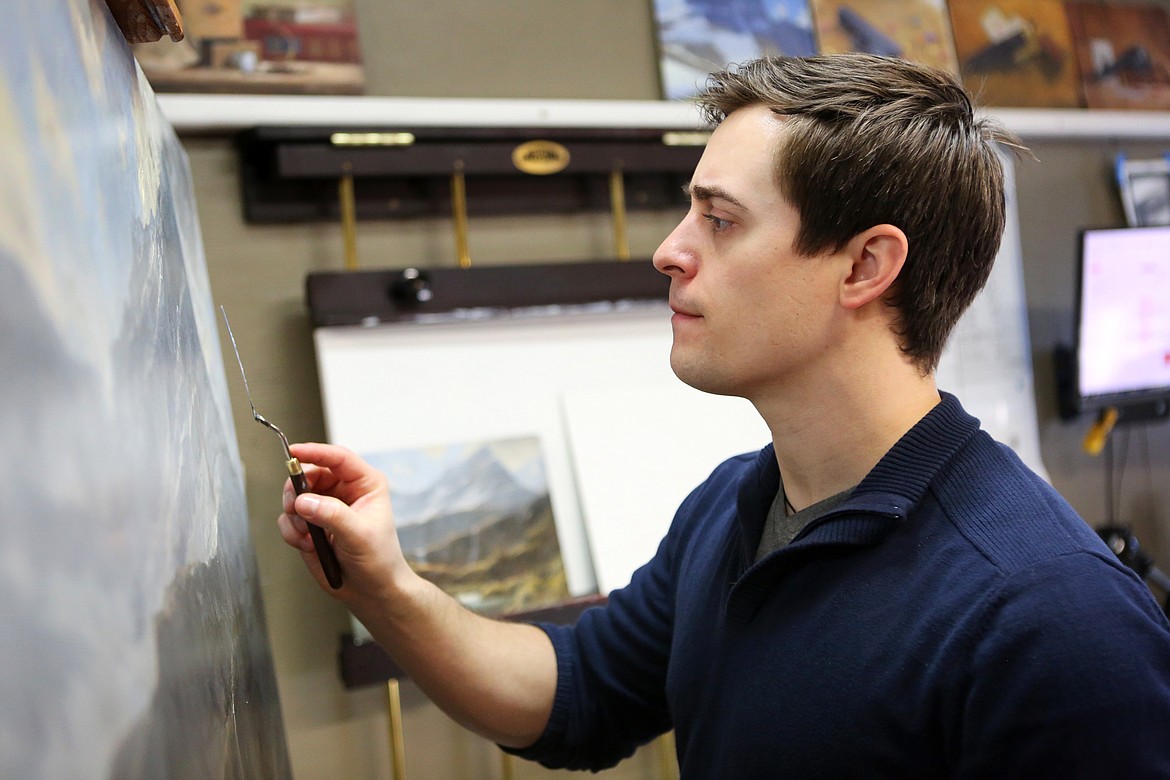 Kenneth Yarus works on a landscape piece in his Kalispell studio Jan. 30. (Mackenzie Reiss/Daily Inter Lake)