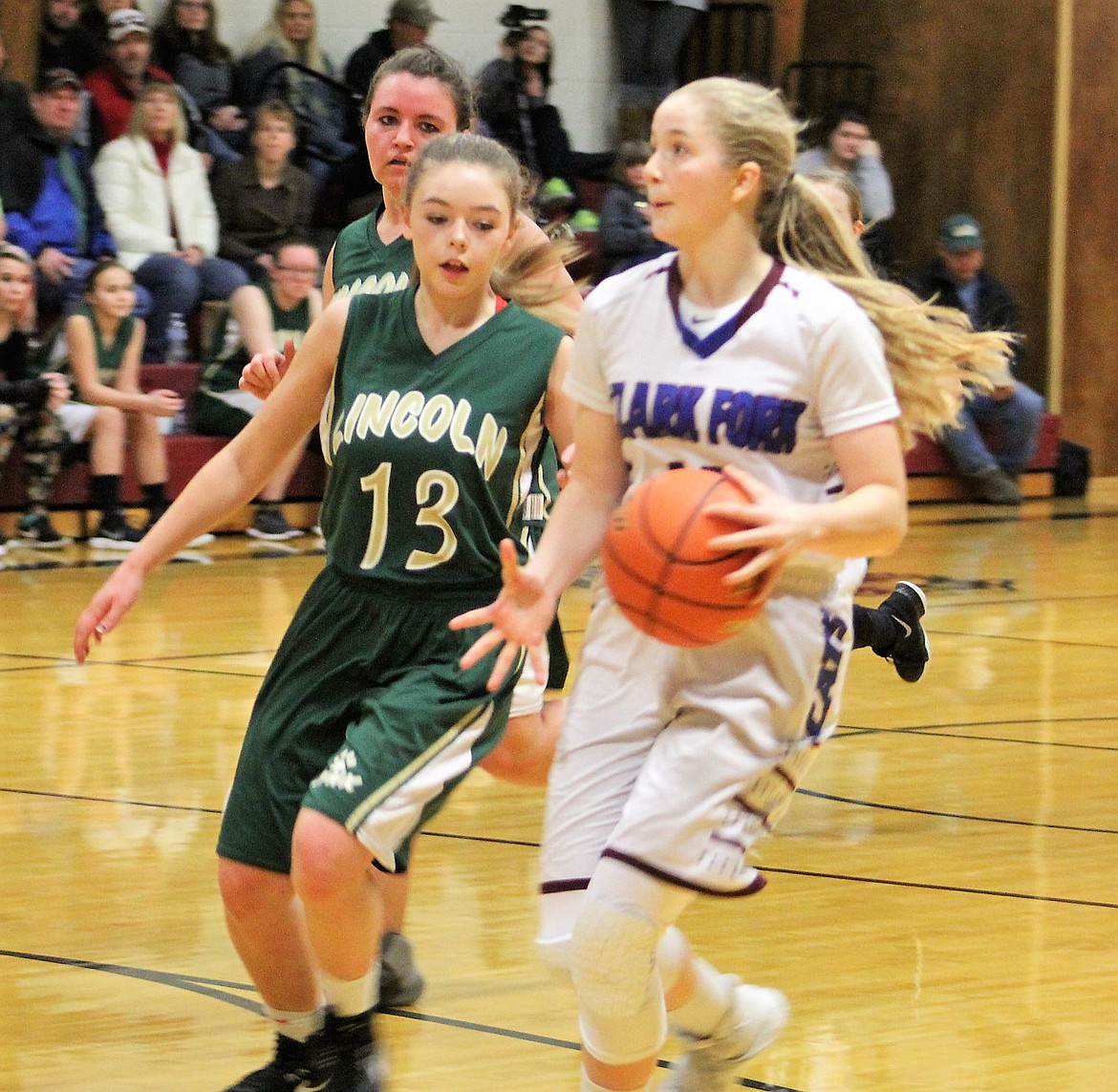 Senior Clark Fork Mountain Cat Hailey Kelly outsteps Lynx Hope Vara during Saturday&#146;s matchup. Kelly had 15 points, helping to push the Cats to their undefeated season win. (Kathleen Woodford/Mineral Independent)