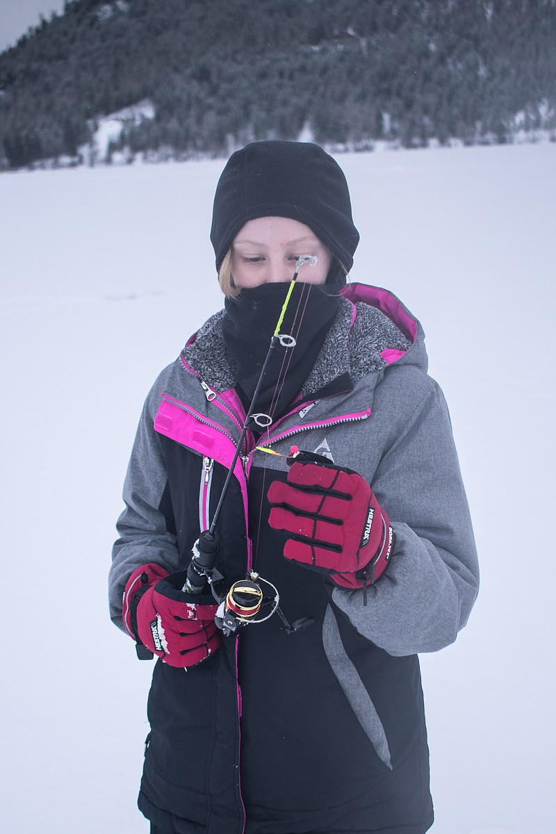 Libby fourth grade student Kaydence Gilroy puts up her pole after a morning of ice fishing at Logan State Park, Jan. 26. Though she didn&#146;t get any bites, it was still a fun time, she said. (Ben Kibbey/The Western News)