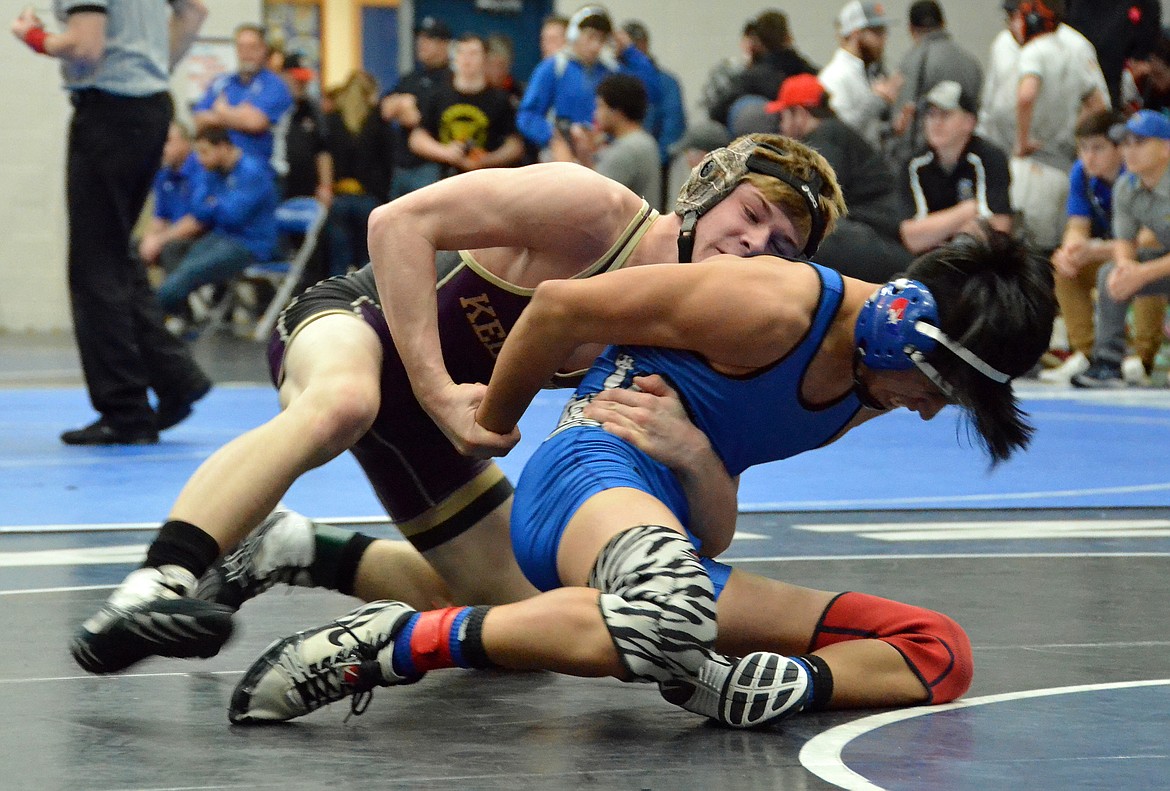 Photo by Amy Stepro 
Juddson Hall controls his opponent&#146;s back during a match at the North Idaho Rumble at Coeur d&#146;Alene High School.