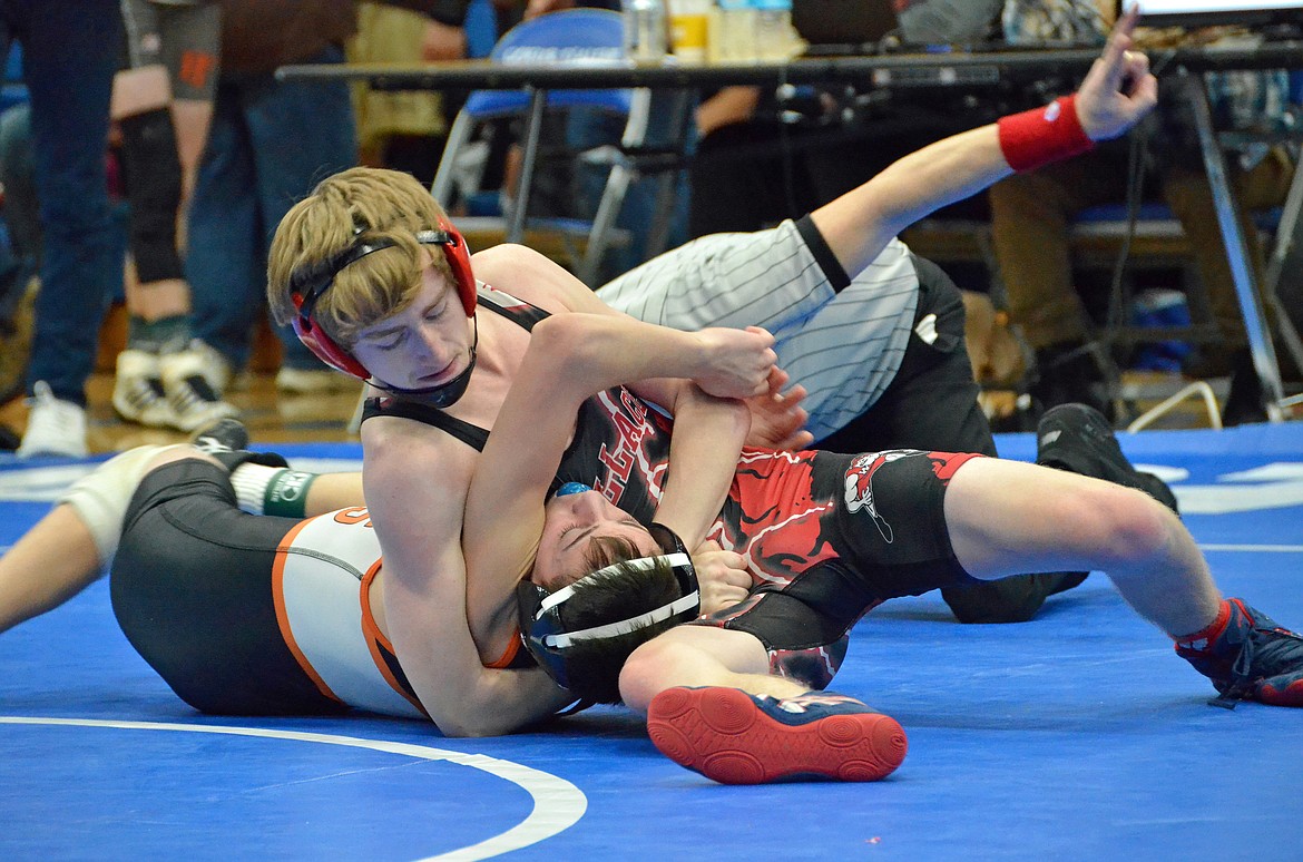 Photo by Amy Stepro
Wallace grappler Austin McKinnon rolls his opponent over.