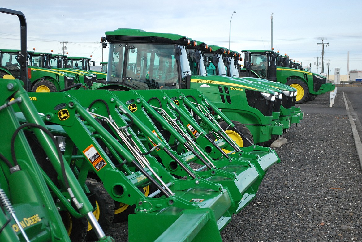 Bob Kirkpatrick/The Sun Tribune - Tractor row at Evergreen Implement in Othello. The company is in the midst of inventorying all parts and equipment as part of its due diligence of the sale to RDO.