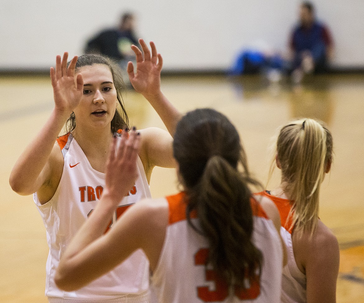 Post Falls post Sydney Parks celebrates with fellow teammate Melody Kempton after defeating Lewiston for the 5A Region 1 championship Tuesday night at Post Falls High School. (LOREN BENOIT/Press)