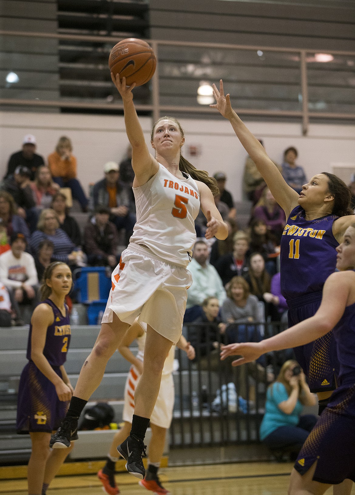 Post Falls guard Mackenzie Morris goes for a layup against Lewiston's Kendyll Kinzer in the 5A Region 1 Championship game Tuesday night at Post Falls High School. (LOREN BENOIT/Press)