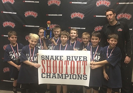 Courtesy photo
The Running Rebels fourth-grade AAU boys basketball team won the championship at the Snake River Shootout. In the front row from left are Braxton Barker, Elliot Ries, Cashton Bodman and Caden Reese; and back row from left, Isaiah Naylor, Jayce Ostlund, Conner Carver, Jayden Smith, Jaxon Lynse and coach Shaun Leary.