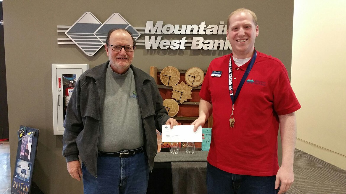 (Courtesy photo)
Idaho Forest Group Executive Vice President, Bob Boeh, delivers $5,000 check to Josh Anderson for The Idaho Mythweaver Native Voices fundraising campaign.