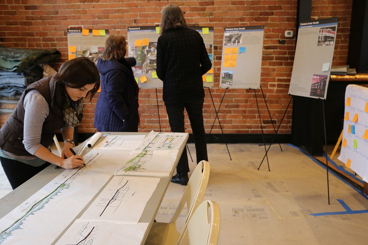 (Photo by MARY MALONE)
Morgan Maiolie with Walker Macy sketches some designs of the University of Idaho property on Boyer Avenue during an open house this week, hosted by the city Planning and Zoning Commission, along with representatives from partnering organizations Studio Cascade, Walker Macy and Idaho Smart Growth.