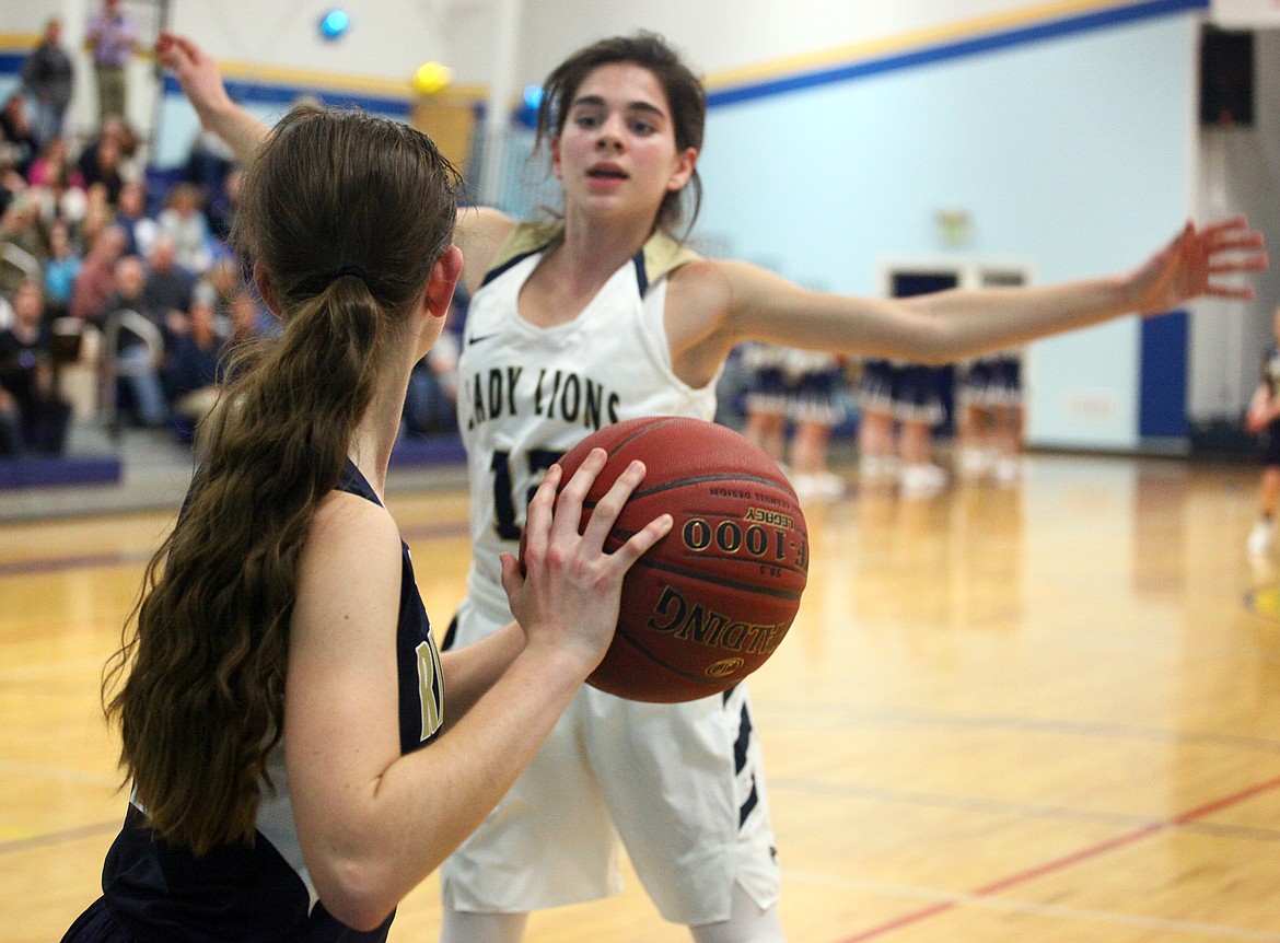 Rodney Harwood/Columbia Basin HeraldMoses Lake Christian's Aspen Merkle (12) defends the inbounds pass during the second half of Thursday night's game in Moses Lake.