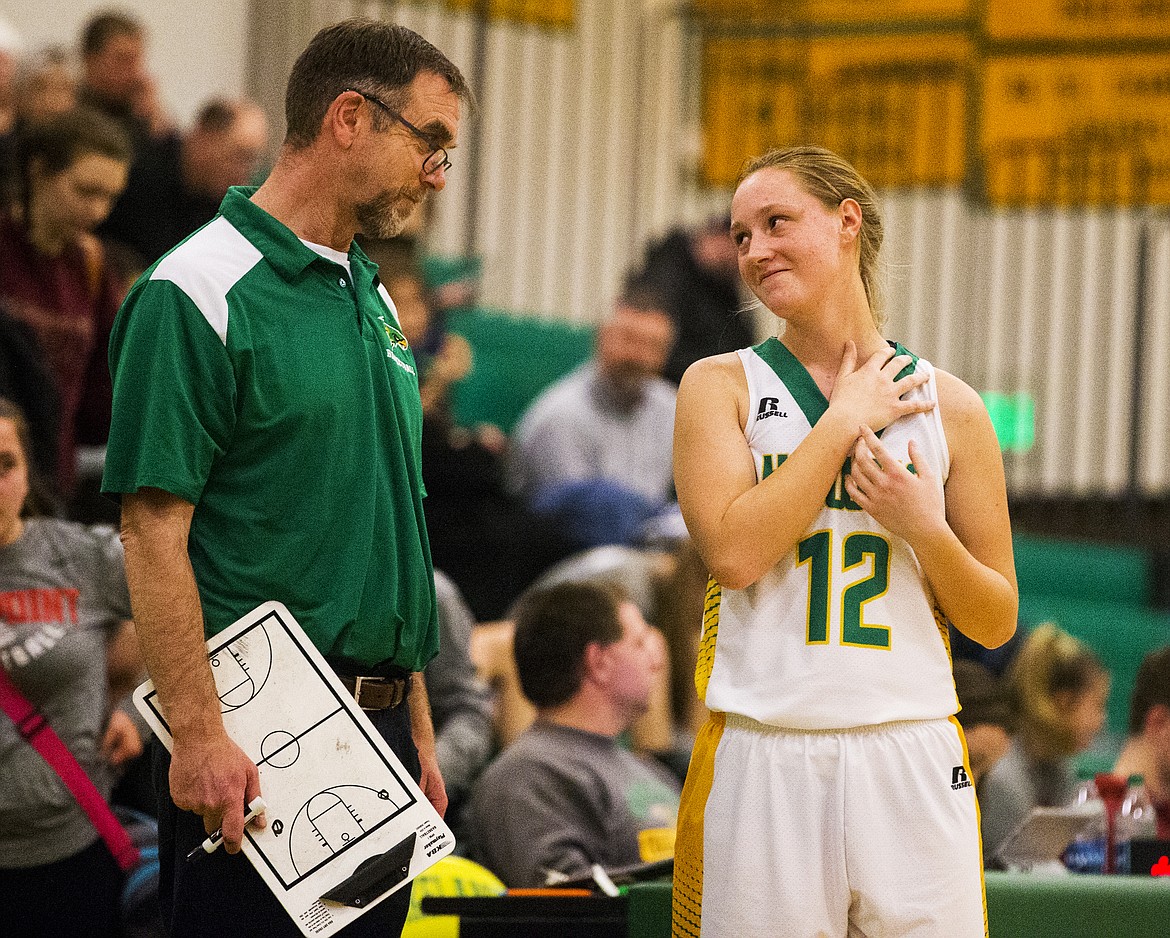 Lakeland girls basketball coach Steve Seymour shares a moment with Makenzie Edinger.