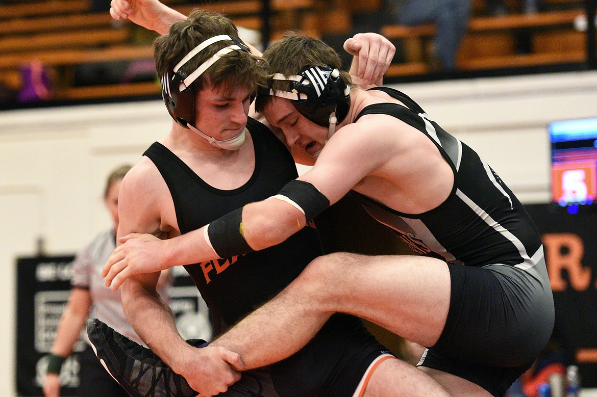 Flathead's Kenyon Fretwell wrestles Missoula Sentinel's Luke Joy at 152 pounds at the Western AA Divisional seeding tournament at Flathead High School on Saturday. Fretwell won by pin. (Casey Kreider/Daily Inter Lake)