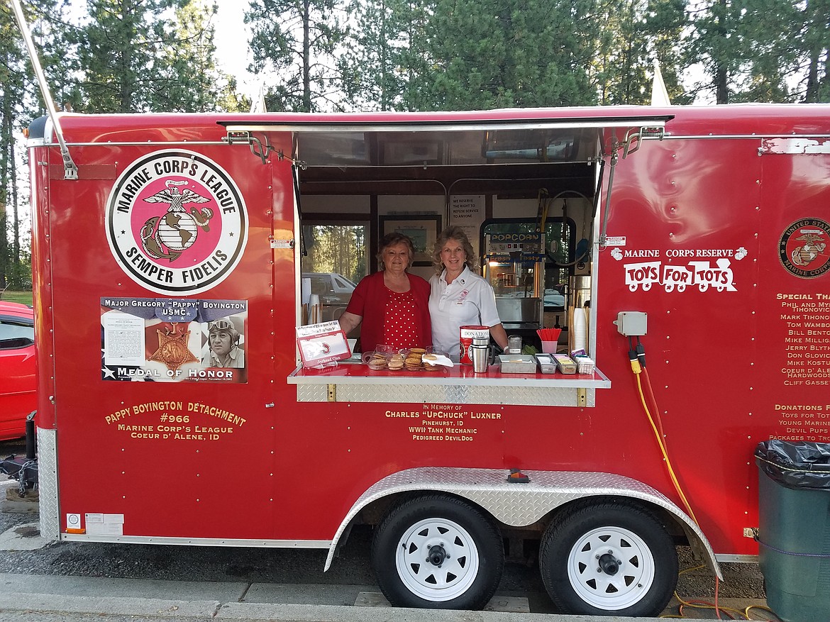 Marine Corps League Auxiliary Pappy Boyington Unit treasurer Paulette Gaffney, left, and president Tina Batha pause for a moment during their work providing free refreshments to travelers at the Huetter rest stop, where the auxiliary ladies run the coffee wagon on July 2, 3 and 4 each year. Their organization is the only Marine Corps League auxiliary left in the state of Idaho, and they are always welcoming new members. (Courtesy photo)