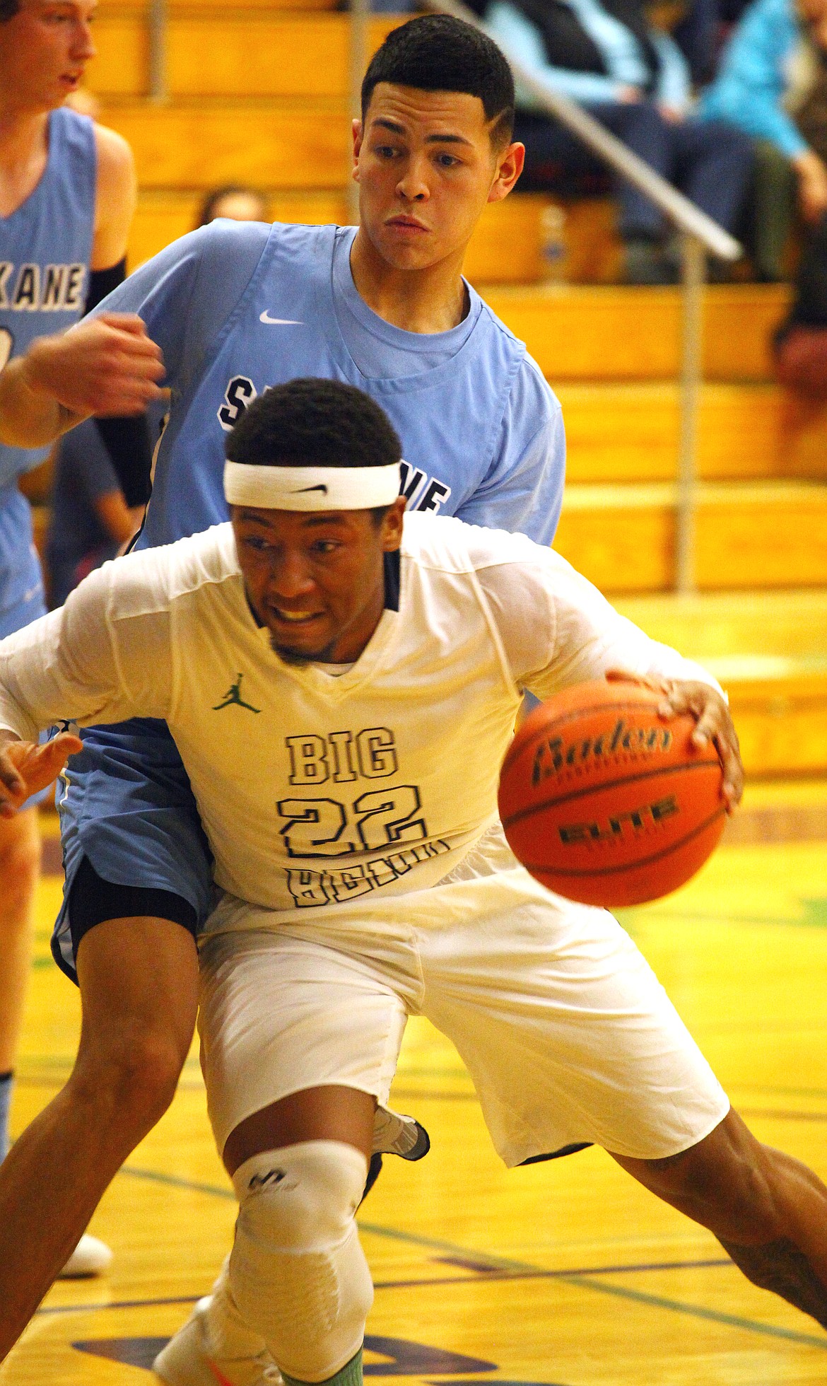 Rodney Harwood/Columbia Basin HeraldBig Bend guard DeAngelo Stowers (22) drives against the defense of Spokane's JR Delgado of Warden (32) during Wednesday night's NWAC East game at DeVries Activity Center.