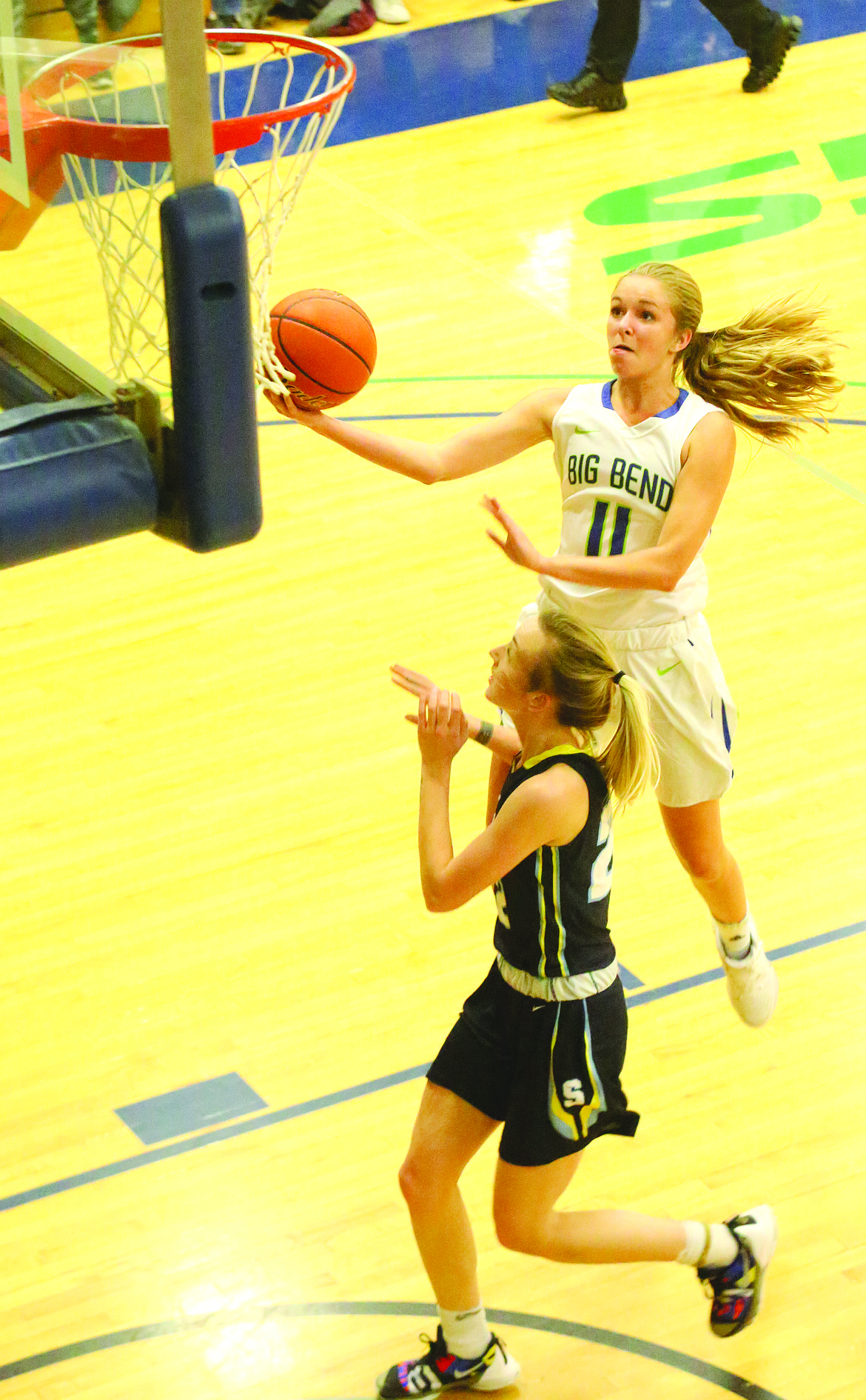 Connor Vanderweyst/Columbia Basin Herald
Big Bend's Miranda Johnson (11) elevates for a lay-up in the first half against Spokane.