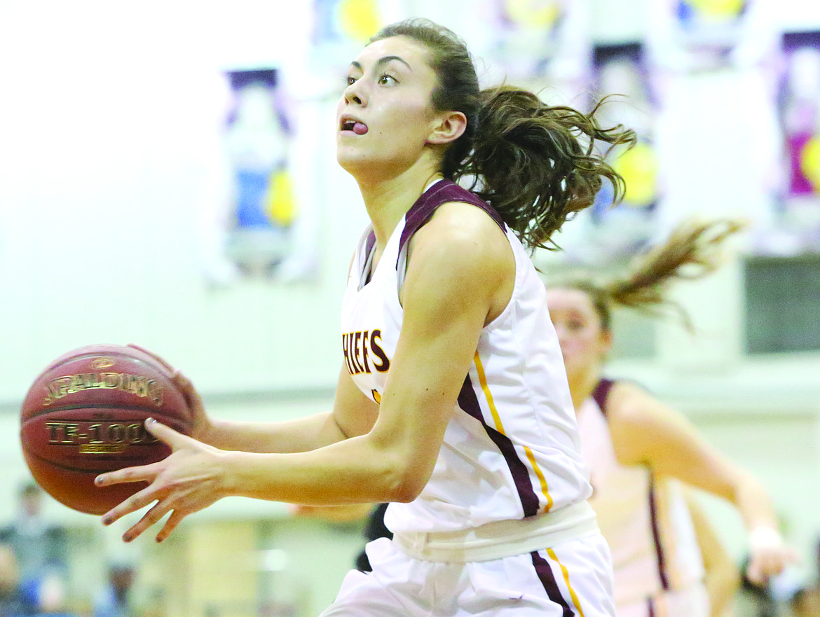 Connor Vanderweyst/Columbia Basin Herald
Moses Lake point guard Jamie Loera performs a no-look pass against Wenatchee.